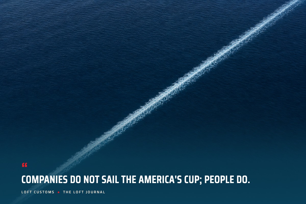 Pull quote over aerial ocean water: Companies do not sail the America's Cup; people do. Loft Customs, The Loft Journal